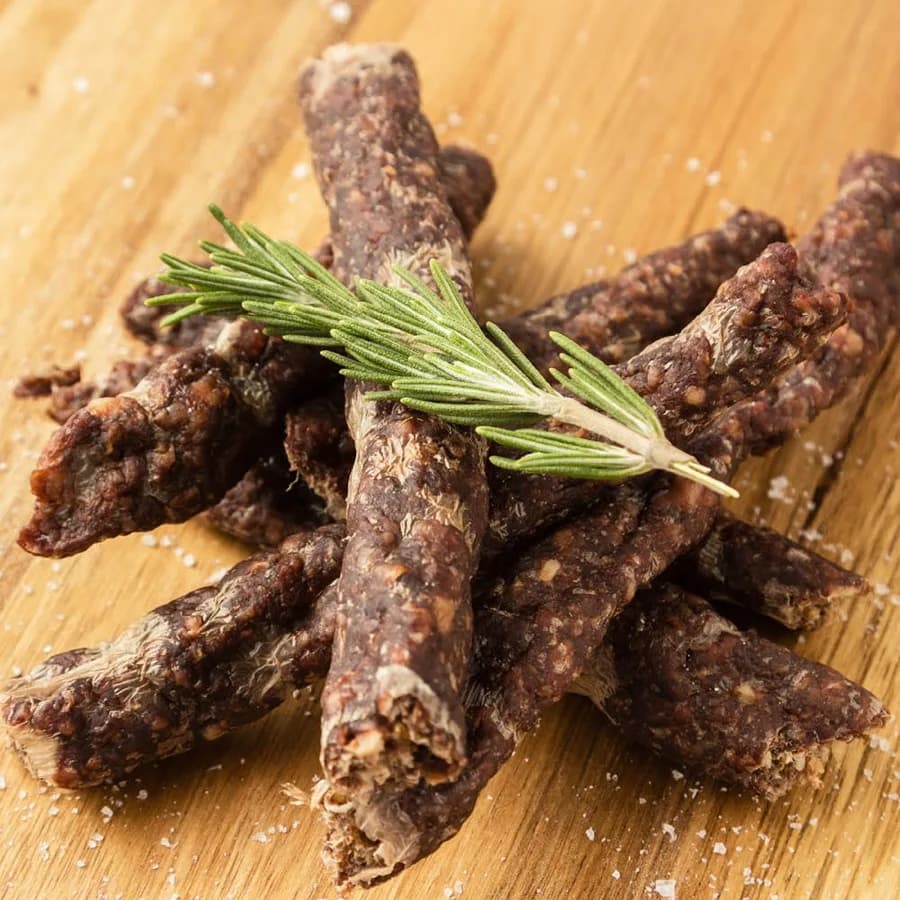Droëwors with a sprig of rosemary
